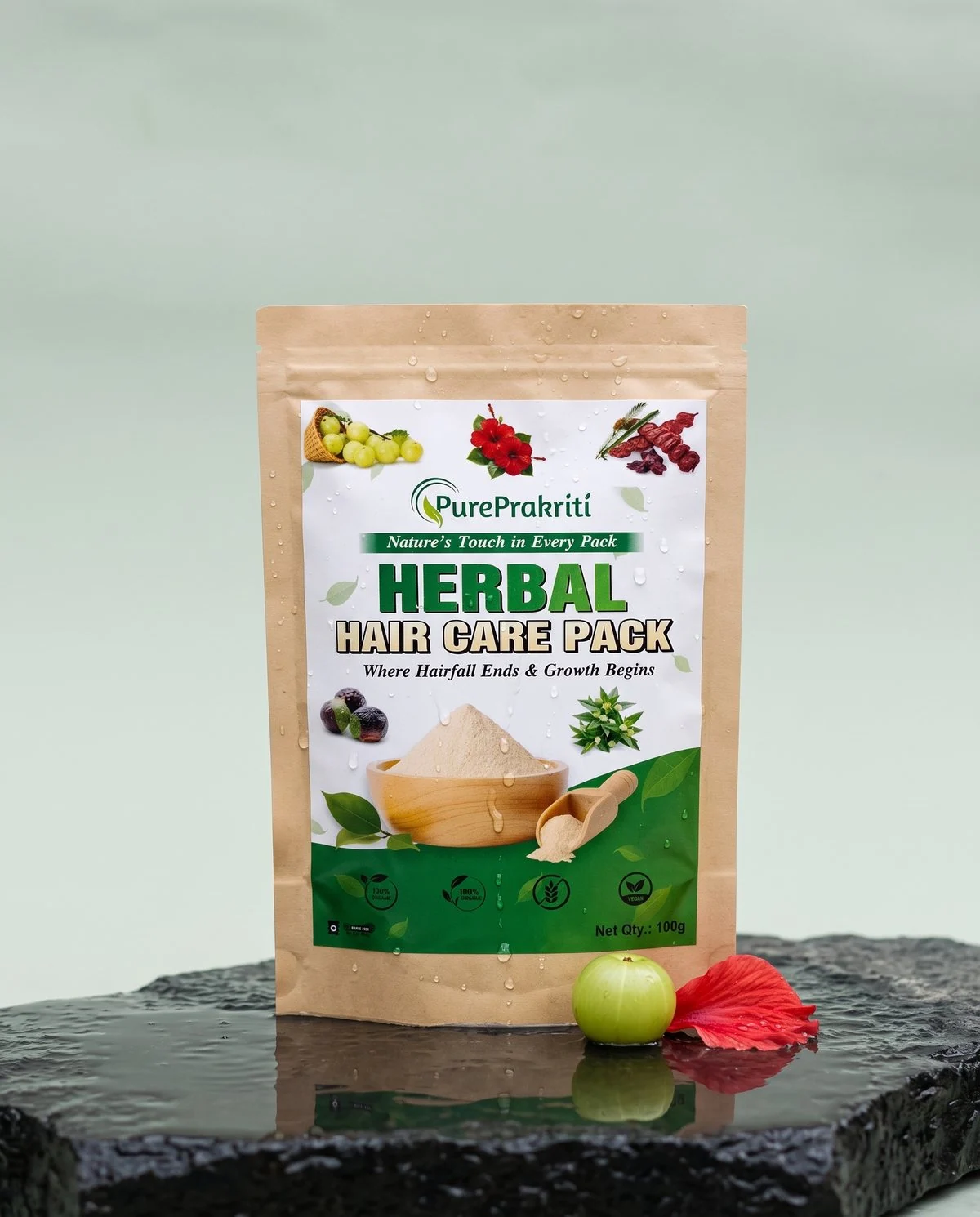 The Herbal Hair Care Pack on wet stone